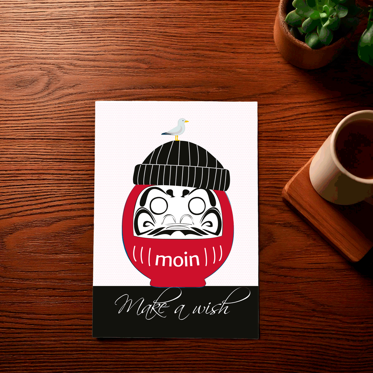 In einer Abfolge werden die Augen auf einer Daruma-Postkarte ausgemalt.